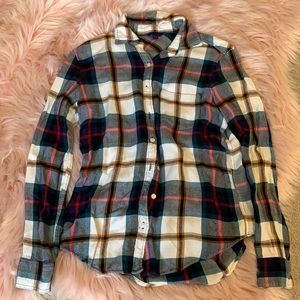 Multi colored button up plaid shirt.